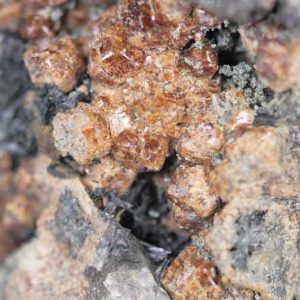 Grossular (var. hessonite), vesuvianite