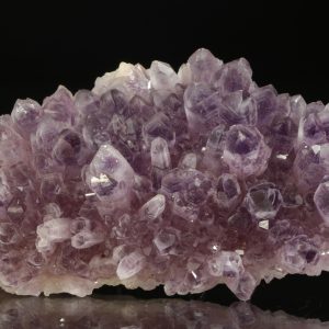 Ametyst in English is Amethyst. However, it is not specified in the provided excerpts, but "Hradbový ametyst" translates to "Chevron amethyst" .